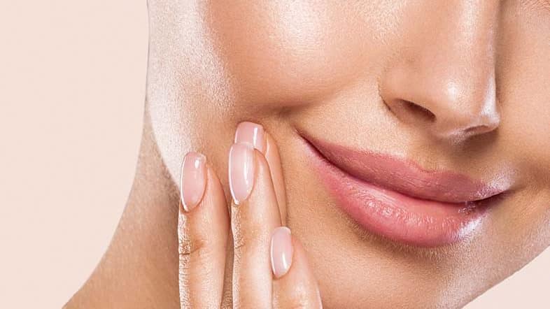 woman smiling facial peels featured image scaled compressed edited 1