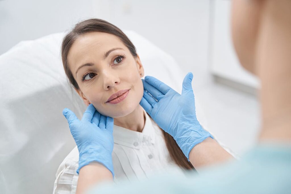 woman having facial skin examination